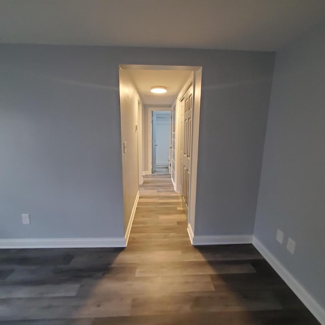909 College Ave, Racine, WI 53403 - hall featuring wood finished floors and baseboards