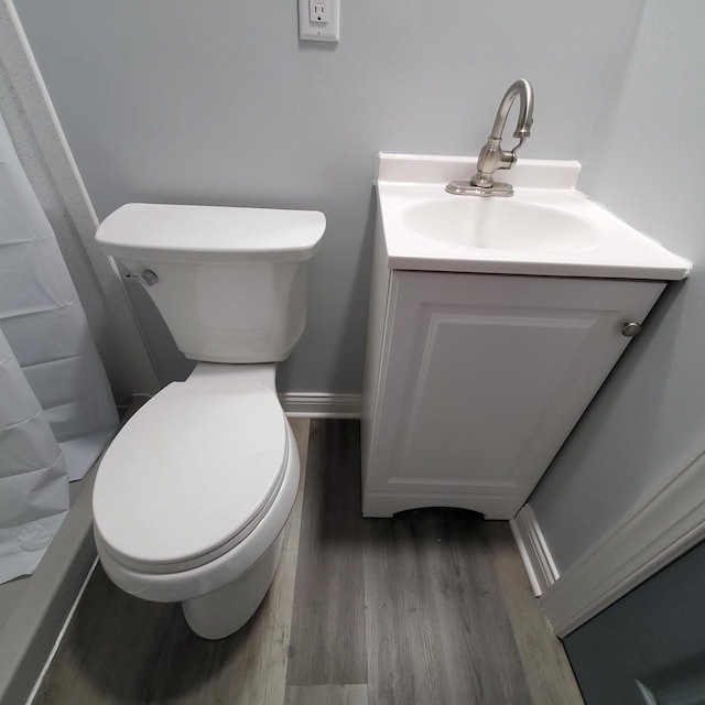 909 College Ave, Racine, WI 53403 - bathroom with wood finished floors and vanity