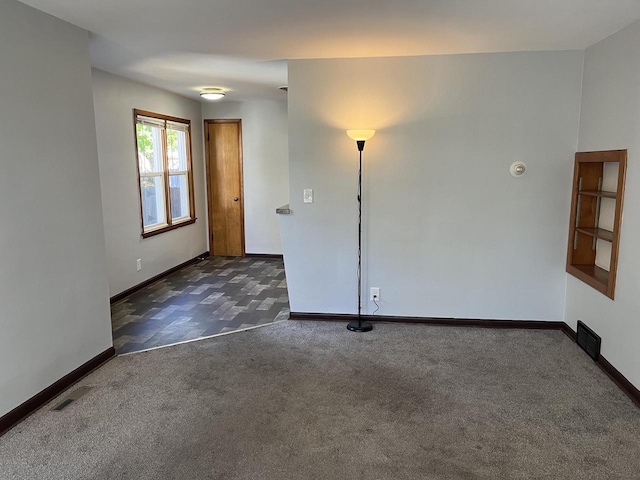 909 College Ave, Racine, WI 53403 - empty room with carpet floors and baseboards