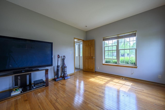 5278 W Highlands Ct, Franklin, WI 53132 - unfurnished living room featuring hardwood / wood-style flooring and baseboards