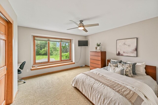1441 W County Line Rd, River Hills, WI 53217 - carpeted bedroom with baseboards and ceiling fan