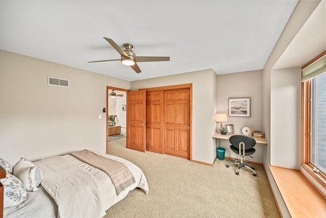 1441 W County Line Rd, River Hills, WI 53217 - bedroom featuring carpet floors, built in desk, a closet, and ceiling fan