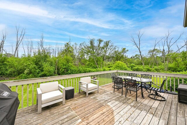 1441 W County Line Rd, River Hills, WI 53217 - wooden deck featuring area for grilling, outdoor dining area, and a yard