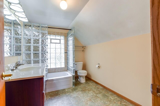 412 High St, Arena, WI 53503 - bathroom featuring vaulted ceiling, vanity, and shower / bath combination