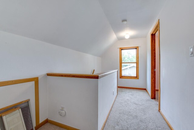 412 High St, Arena, WI 53503 - hallway with light colored carpet, lofted ceiling, and an upstairs landing