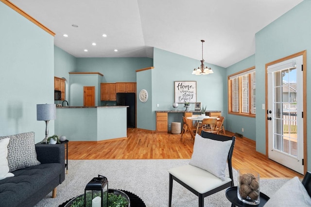 4017 Sandhill Dr, Janesville, WI 53546 - living room featuring a chandelier, light wood-type flooring, recessed lighting, and high vaulted ceiling