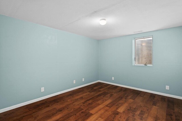 4017 Sandhill Dr, Janesville, WI 53546 - empty room with baseboards and dark wood-style flooring