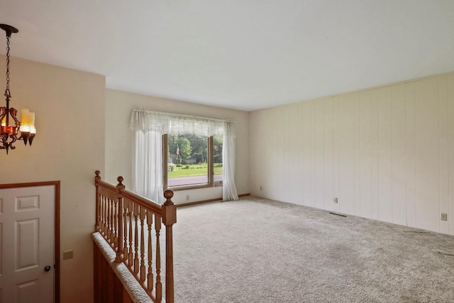 6521 Batavia Ave, Wisconsin Rapids, WI 54494 - empty room with a chandelier and carpet floors