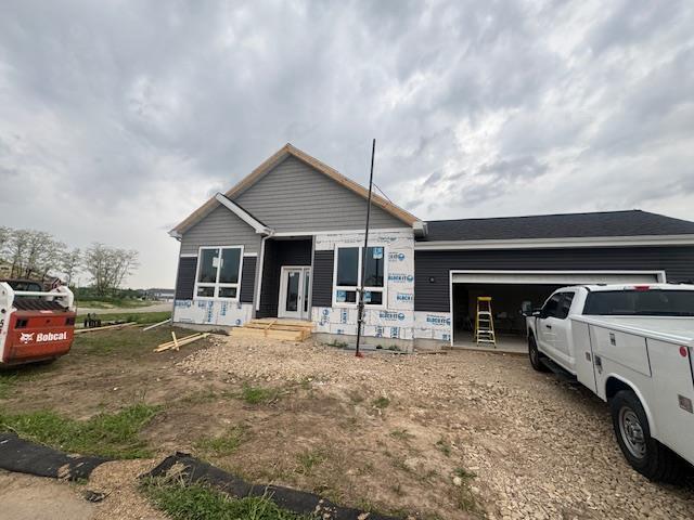 6671 Warner Farm Dr, Deforest, WI 53532 - view of front of property with an attached garage