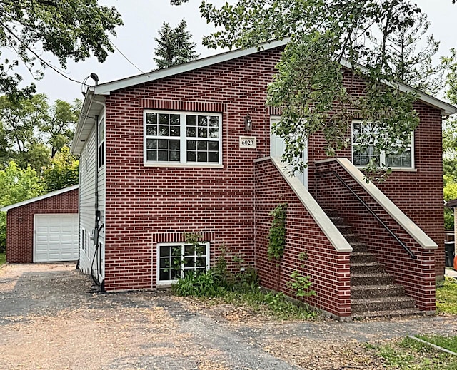 6023 241st Ave, Salem, WI 53168 - view of front facade with asphalt driveway, brick siding, and a garage