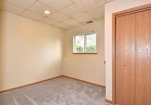 6023 241st Ave, Salem, WI 53168 - unfurnished bedroom with a paneled ceiling, carpet flooring, baseboards, and a closet