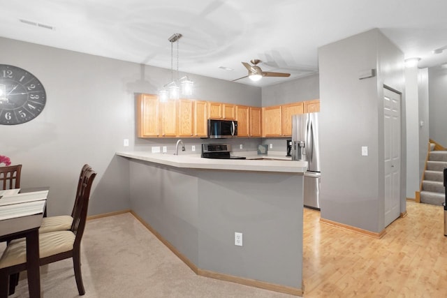 2422 Fox River Pkwy Unit B, Waukesha, WI 53189 - kitchen with stove, stainless steel refrigerator with ice dispenser, a peninsula, light countertops, and baseboards