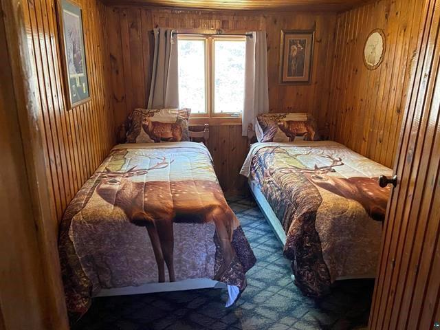 12770 Scenic Dr, Delta, WI 54847 - carpeted bedroom with wood walls