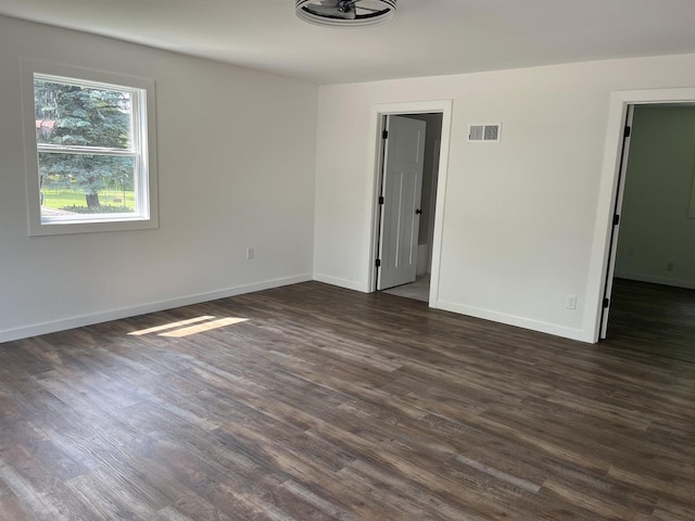 524 Charles St, Reedsburg, WI 53959 - spare room featuring dark wood-style flooring and baseboards