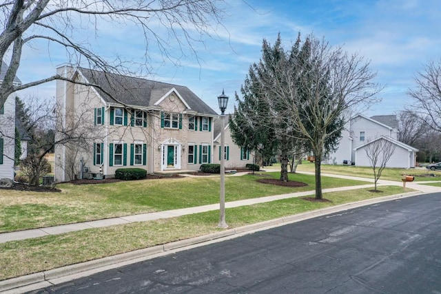 4138 Redtail Pass, Middleton, WI 53562 - colonial house with a front yard and a chimney