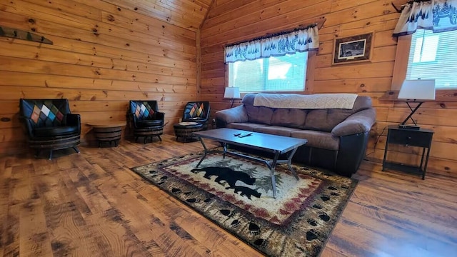 716 Skatepark Ct, Warrens, WI 54666 - living area with healthy amount of natural light, wood finished floors, and wooden walls