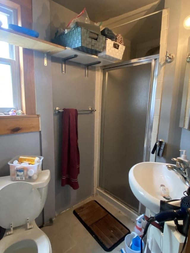1139 E Kane Pl Unit 1139A, Milwaukee, WI 53202 - full bath with a stall shower, a sink, toilet, tile patterned flooring, and decorative backsplash