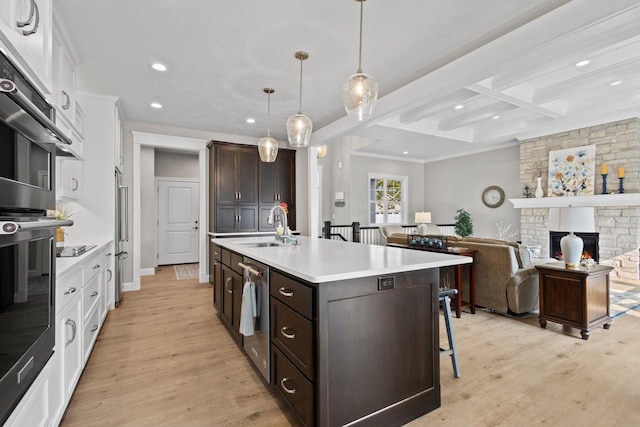 878 Whisper Falls Ln, Menasha, WI 54952 - kitchen with recessed lighting, white cabinetry, a kitchen bar, dishwasher, and light countertops