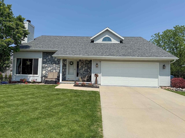1053 Eastman Ln, Fond Du Lac, WI 54935 - view of front facade with a front lawn, driveway, a garage, and a chimney