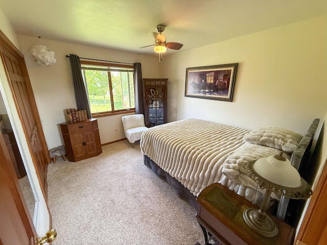 1053 Eastman Ln, Fond Du Lac, WI 54935 - bedroom with light colored carpet, a ceiling fan, and baseboards