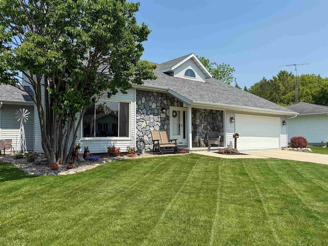 1053 Eastman Ln, Fond Du Lac, WI 54935 - view of front of home with stone siding, an attached garage, a front yard, and concrete driveway
