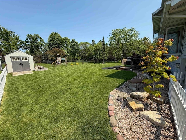 1053 Eastman Ln, Fond Du Lac, WI 54935 - view of yard with a playground and view of wooded area