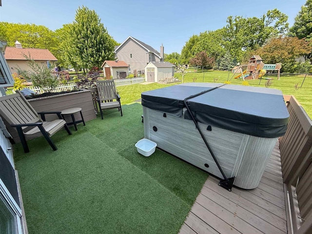 1053 Eastman Ln, Fond Du Lac, WI 54935 - view of yard featuring a hot tub, a playground, and a wooden deck