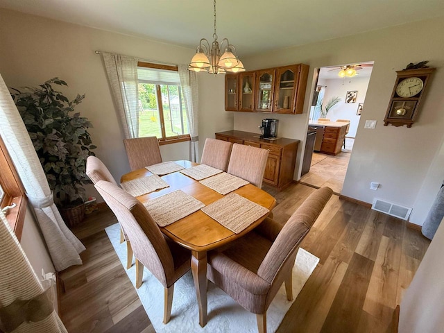 1053 Eastman Ln, Fond Du Lac, WI 54935 - dining space with light wood-style flooring and a chandelier