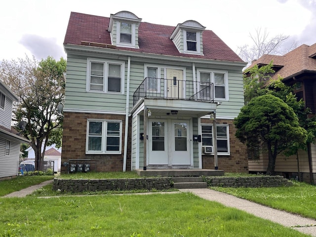 2919 N 50th St Unit 2919A, 2921, Milwaukee, WI 53210 - view of front of property with a balcony and a front yard