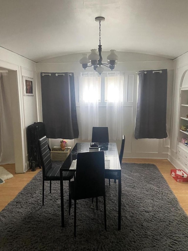 2919 N 50th St Unit 2919A, 2921, Milwaukee, WI 53210 - dining room with a chandelier, lofted ceiling, and light wood finished floors