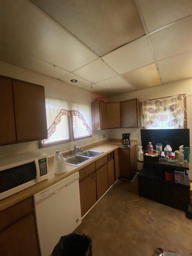 2919 N 50th St Unit 2919A, 2921, Milwaukee, WI 53210 - kitchen with white appliances, a sink, light countertops, and a paneled ceiling