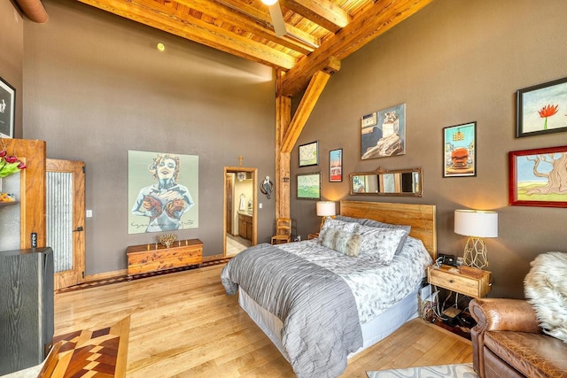 1545 Arboretum Dr Unit 315, Oshkosh, WI 54901 - bedroom with a towering ceiling, wood finished floors, wooden ceiling with exposed beams, and ensuite bath