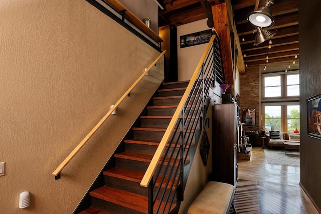 1545 Arboretum Dr Unit 315, Oshkosh, WI 54901 - stairs featuring wood finished floors, a high ceiling, and beamed ceiling