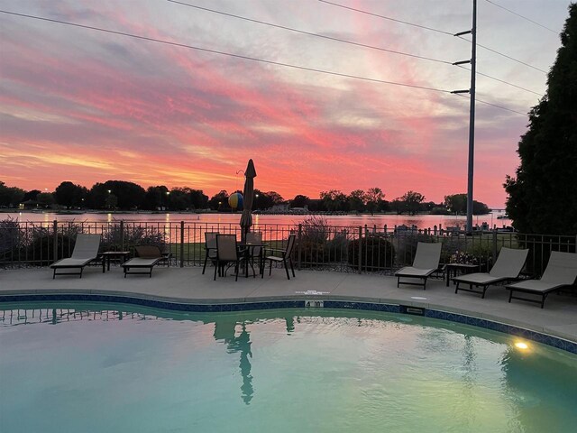 1545 Arboretum Dr Unit 315, Oshkosh, WI 54901 - pool at dusk with a patio and a water view