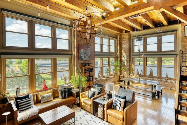 1545 Arboretum Dr Unit 315, Oshkosh, WI 54901 - sunroom with a water view, a chandelier, and beamed ceiling