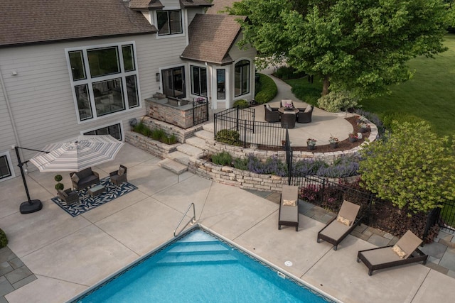 5015 Joshua Dr, West Bend, WI 53090 - view of swimming pool featuring an outdoor hangout area, a patio area, and outdoor dining area