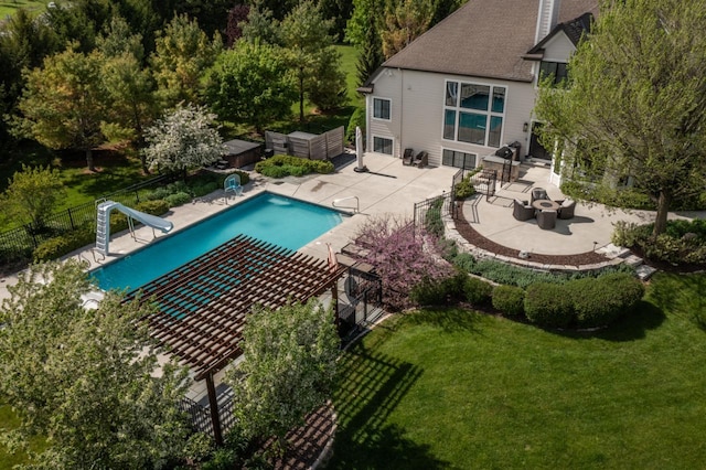5015 Joshua Dr, West Bend, WI 53090 - view of pool with a water slide, a patio, and a fire pit
