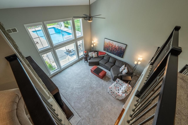 5015 Joshua Dr, West Bend, WI 53090 - carpeted living room with high vaulted ceiling and a ceiling fan