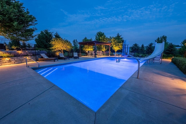 5015 Joshua Dr, West Bend, WI 53090 - view of pool with a pergola, a water slide, and a patio area