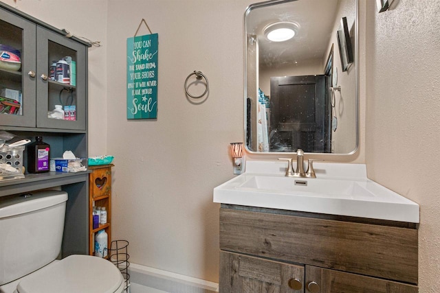 7320 Deer Rd, Wisconsin Rapids, WI 54494 - bathroom with vanity, toilet, and baseboards