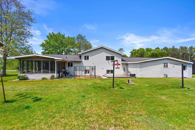 7320 Deer Rd, Wisconsin Rapids, WI 54494 - rear view of property featuring a sunroom, a yard, and a patio area
