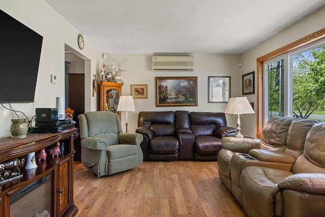 7320 Deer Rd, Wisconsin Rapids, WI 54494 - living area with a wall mounted AC and light wood-style flooring