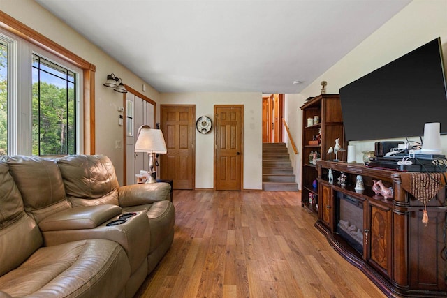 7320 Deer Rd, Wisconsin Rapids, WI 54494 - living room with light wood-style floors and stairway