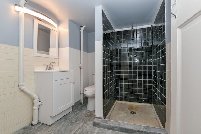 3380 N 39th St, Milwaukee, WI 53216 - full bath featuring toilet, vanity, a tile shower, and tile walls