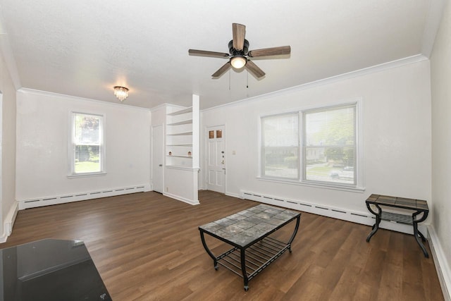 3380 N 39th St, Milwaukee, WI 53216 - unfurnished living room with a baseboard heating unit, ornamental molding, wood finished floors, a ceiling fan, and baseboards