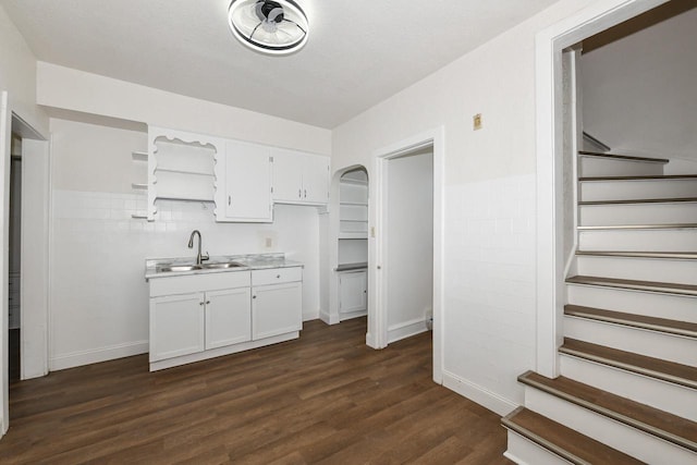 3380 N 39th St, Milwaukee, WI 53216 - kitchen featuring a sink, open shelves, dark wood-style flooring, white cabinets, and light countertops