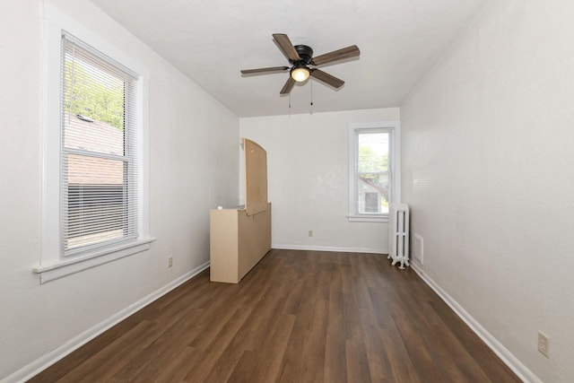 3380 N 39th St, Milwaukee, WI 53216 - unfurnished room featuring radiator, wood finished floors, a ceiling fan, and baseboards