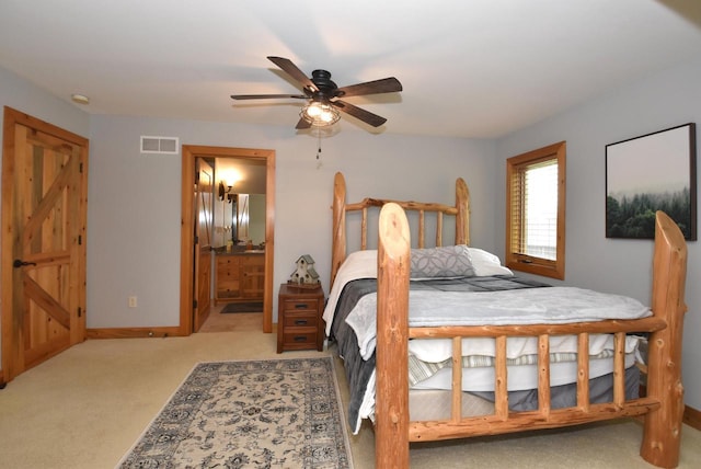 W395S3611 Hardscrabble Rd, Dousman, WI 53118 - bedroom with carpet, baseboards, ensuite bathroom, and a ceiling fan