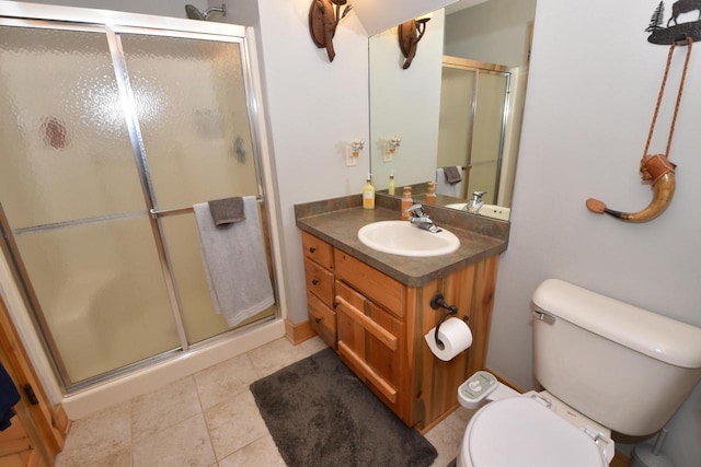 W395S3611 Hardscrabble Rd, Dousman, WI 53118 - bathroom featuring a shower stall, vanity, toilet, and tile patterned floors