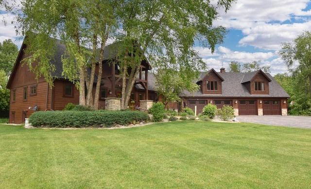 W395S3611 Hardscrabble Rd, Dousman, WI 53118 - view of front facade featuring a chimney, a front lawn, a shingled roof, and driveway